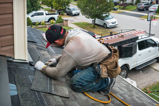 Professional Roofing technician working in Arlington, IN